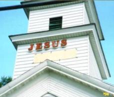 Photo Installing Jesus Saves Sign 2